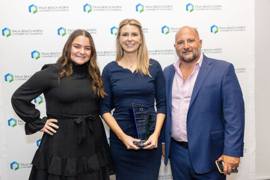 Alyssa Kolb and Peter Baytarian pose with Young Professional of the Year Nicole Plunkett.